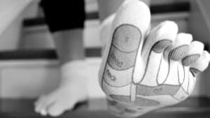 Piedi, calzini con mappa riflessologia plantare